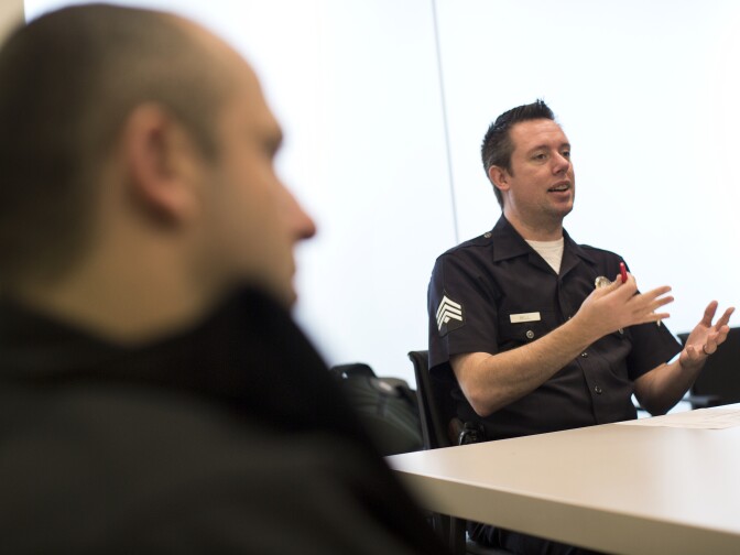 Detective Stephen Bell leads a roll call for the System-wide Mental Assessment Response Teams on Thursday morning, Dec. 11, 2014 at LAPD Headquarters. SMART provided crisis intervention in response to 4,724 calls last year.