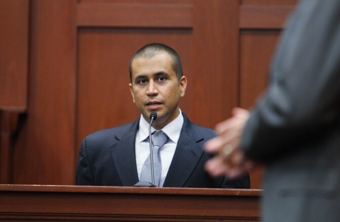 SANFORD, FL- APRIL 20: George Zimmerman (L) speaks on the stand as he answers questions from his his attorney Mark O'Mara in a Seminole County courtroom during his bond hearing on April 20, 2012 in Sanford, Florida. Trayvon Martin was shot by George Zimmerman, a member of a neighborhood watch in Sanford, Florida, who has been charged with second degree murder in the shooting. Bail was set at $150,000 and Zimmerman and could be released from jail as he awaits trial as early as April 21.  (Photo by Gary Green/The Orlando Sentinel-Pool/Getty Images)
