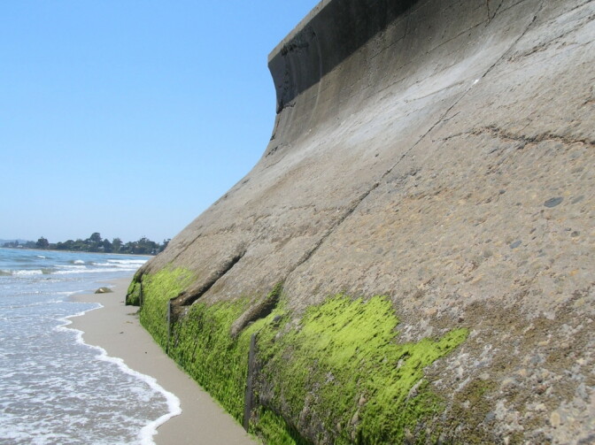 This seawall in Summerland, California reflects waves at high tide. 