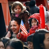NEW YORK, NY - JANUARY 29:  Thousands of people line the streets of New York's Chinatown to see the Chinese New Year parade on January 29, 2012 in New York City. This year celebrates the Year of the Dragon.  (Photo by John Moore/Getty Images)