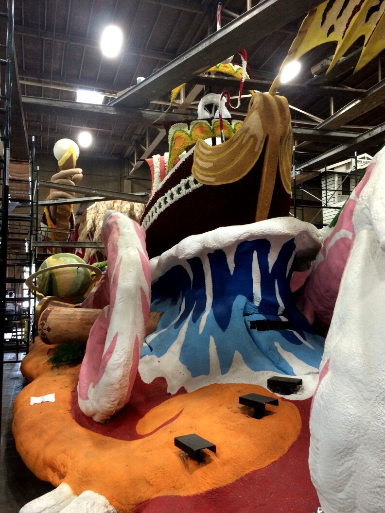 The finishing touches are put on the Western Asset float called "The Power of Imagination," at the Phoenix Decorating Company in Pasadena.