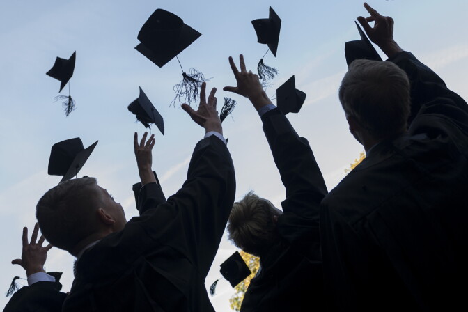 LEIPZIG, GERMANY - AUGUST 30: Graduates in gown and caps celebrate their graduation at the HHL Leipzig Graduate School of Management on August 30, 2014 in Leipzig, Germany. A total of 167 students in various Masters programs of business management graduated today, including the regular MBA program, whose students are 80% from foreign countries, while the more advanced graduate programs have a higher percentage of German-born students. (Photo by Jens Schlueter/Getty Images)