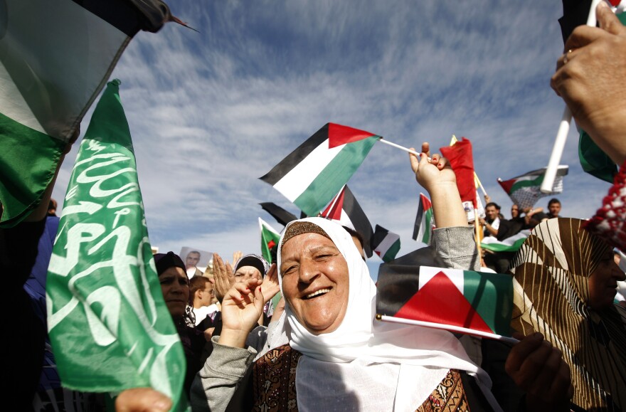 Palestinians celebrate the prisoner swap deal reached between Israel and Hamas outside Ofer prison near the West Bank city of Ramallah on October 18, 2011. Hundreds of people gathered in Ramallah to celebrate the return of prisoners freed under a swap deal with Israel which freed captured Israeli soldier Gilad SHlait after five years of captivity. AFP PHOTO/AHMAD GHARABLI (Photo credit should read AHMAD GHARABLI/AFP/Getty Images)