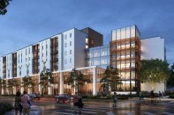 A rendering of what the new dorm will look like in the evening. The building is a mix of steel, glass, and wood. It is aglow with light from within, surrounded by small trees. People roam about, some in pairs. One is on a bicycle. 