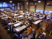 In this Wednesday, May 20, 2009 file photo, several hundred inmates crowd the gymnasium at San Quentin prison in San Quentin, Calif.
