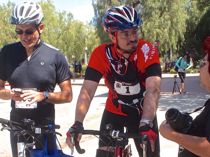 Damian Kevitt (center) at the finish line during the Finish the Ride event.