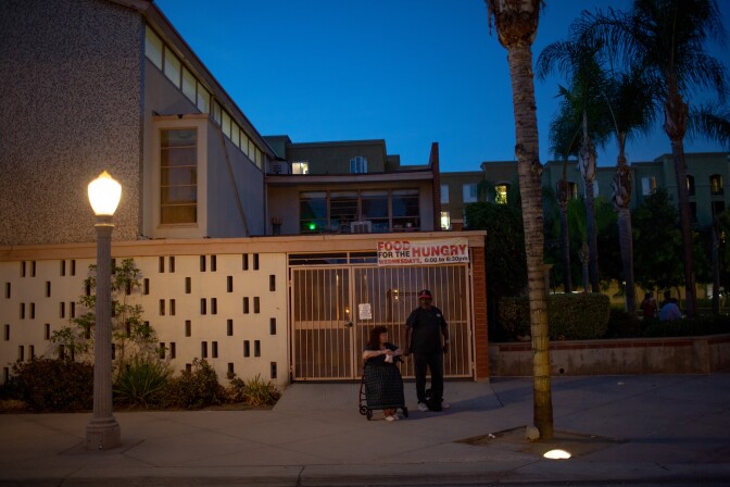 Donna Lynn and Curtis Gamble stand outside of a church dinner in Fullerton, California.There are mixed opinions on a housing project for homeless people proposed for the 1600 block of Commonwealth Avenue in Fullerton, California. (Kyle Grillot for KPCC)