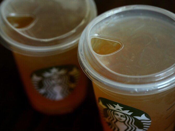 SAUSALITO, CA - JULY 09:  A new flat plastic lid that does not need a straw is shown on a cup of Starbucks iced tea on July 9, 2018 in Sausalito, California. Starbucks announced today that it plans on phasing out all plastic straws from its 28,000 stores worldwide by 2020. Some of its drinnk cups will be fitted with special flat plastic lids that can be used without straws.  (Photo by Justin Sullivan/Getty Images)