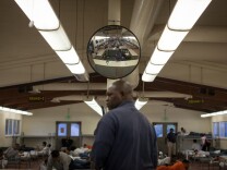 A juvenile detention officer barks orders to dozens of teens in the early morning hours at Camp Afflerbaugh.
