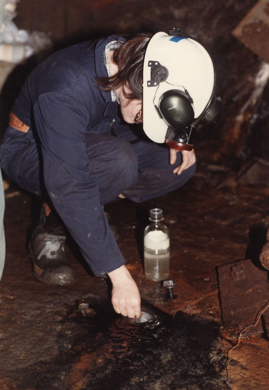 A scientists takes a sample of water from a mine deep underground in Ontario, Canada. The water turned out to be 2.6 billion years old, the oldest known water on Earth.
 