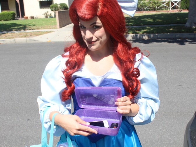 Michele hides the last of her real-life affects before stepping into a gig in Burbank as the Little Mermaid.