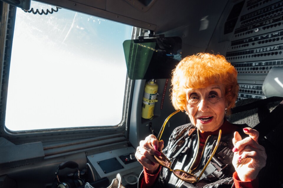 Elinor Otto enjoys her first flight aboard a C-17 after a 50-year career assembling military planes at the Long Beach Boeing plant.