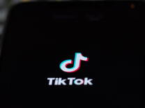 A close-up of the TikTok logo on a phone screen. 