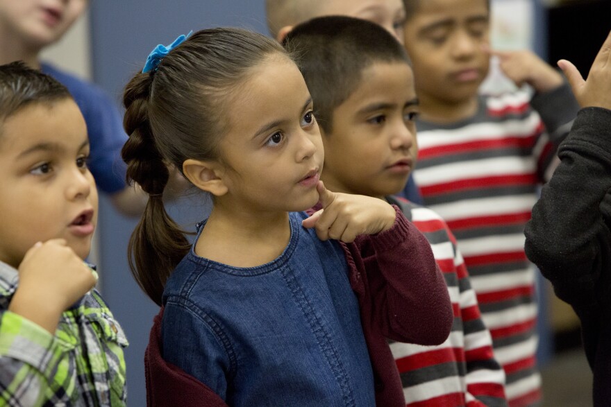 Lily De Dios sings in Mr. Morris' kindergarten dual immersion class at Stone Avenue Elementary School in California's Jurupa Valley on Friday, November 4th, 2016.