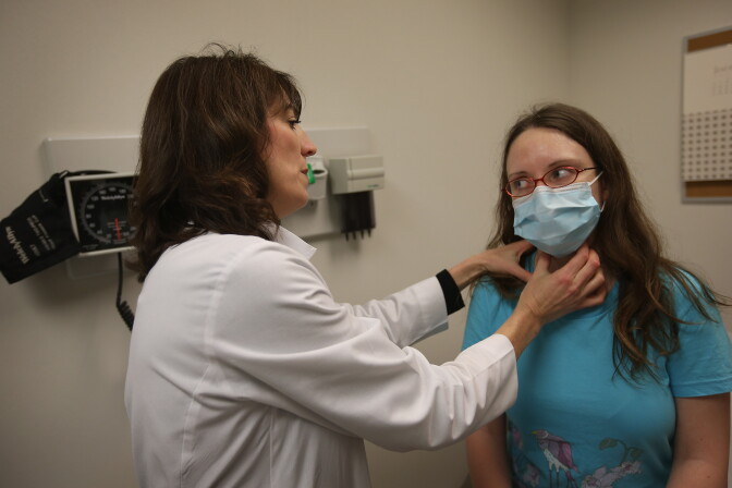 CHICAGO, IL - JANUARY 10:  Dr. Anne Furey Schultz examines Alice Corcoran, who was experiencing flu-like symptoms, at Northwestern Memorial Hospital on January 10, 2013 in Chicago City.  According to the Centers for Disease Control and Prevention flu is widespread in 41 states. The CDC has reported 22,048 flu cases from Sept. 30 through December 31, 2012 compared with only 849 for the same period last year.  (Photo by Scott Olson/Getty Images)