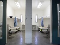 Two women occupy one cell at the Twin Towers Correctional Facility in downtown Los Angeles. Other women sleep in the common area on day beds due to overcrowding.