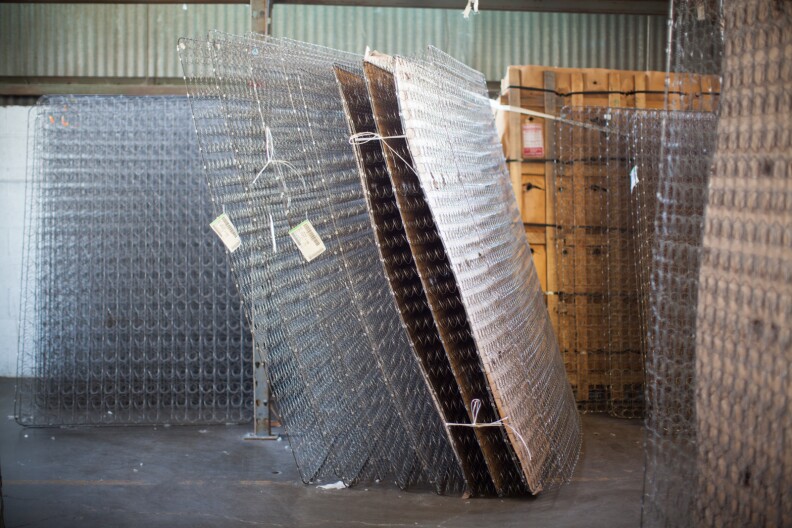 Steel springs arrive at the Custom Comfort Mattress factory in pack of 15 that have 20,000-lbs of pressure per pack.
