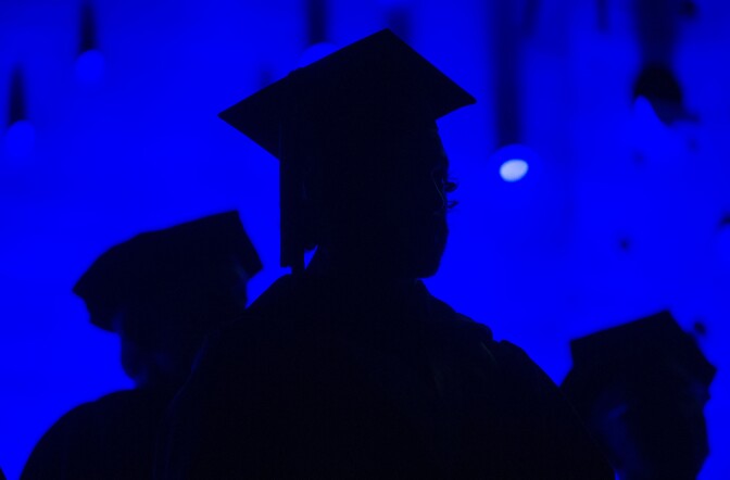 FILE - In this Saturday, May 31, 2014, file photo, members of the graduating class and faculty attend the Savannah College of Art and Design commencement in Atlanta. For the first time on record, living with parents is now the most common arrangement for Americans ages 18 to 34, an analysis of Census data by the Pew Research Center has found. The sharp shift reflects a long-running decline in marriage age, amplified by the economic upheavals of the Great Recession. The trend has been particularly evident among Americans who lack a college degree. (AP Photo/John Amis, File)