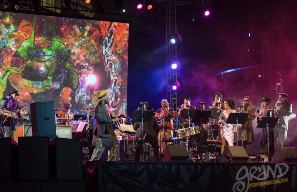 A musical act plays to an enthusiastic audience as part of Grand Performances, a free concert series in downtown Los Angeles.