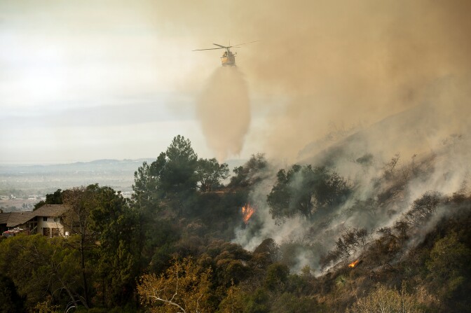Firefighters work to fight the Colby Fire in the mountains near Glendora on Thursday. The blaze has burned 1,700 acres so far according to LA County Fire as of 10:07 a.m. on Thursday. 