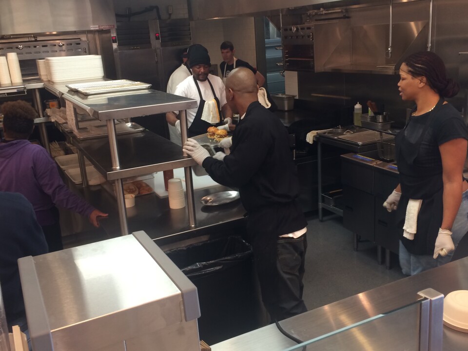 Line workers in the kitchen of LocoL are preparing for opening day. LocoL is a new fast food restaurant created by chef Roy Choi in the Watts neighborhood of LA.