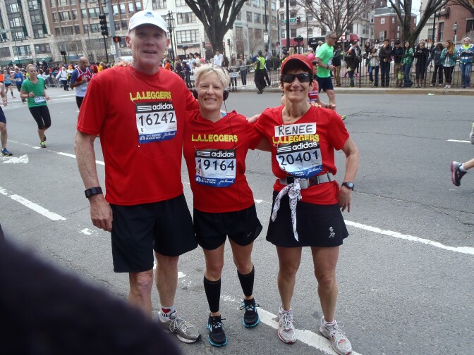 Renee Opell with friends Phil Kent and Jennifer Hartman at the 2013 Boston Marathon, mile 25. This photo was taken just minutes before the first blast. 