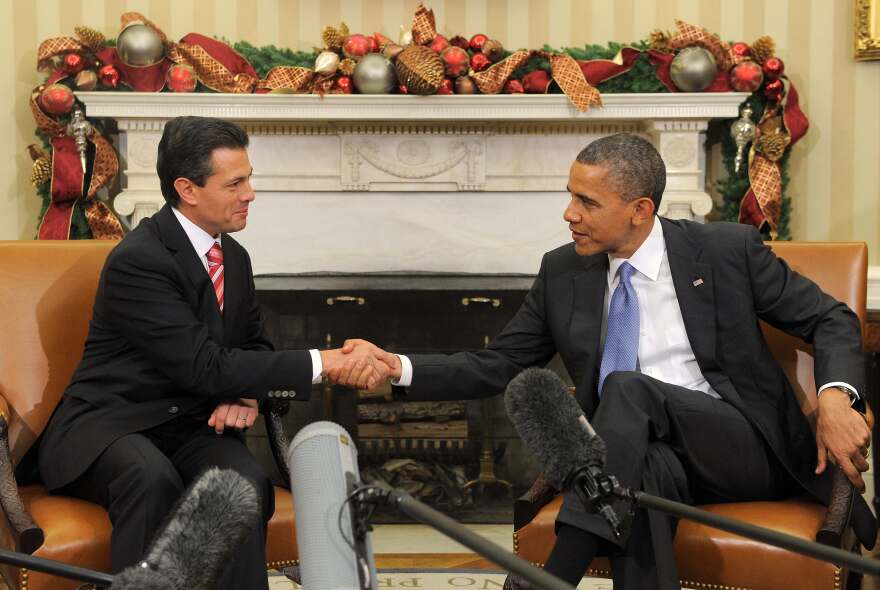 US President Barack Obama shakes hands with President-elect Enrique Pena Nieto of Mexico during a bilateral meeting in the Oval Office at the White House in Washington on November 27, 2012. Pena Nieto, a member of the Institutional Revolutionary Party (PRI), takes office on December 1, replacing Felipe Calderon from the conservative National Action Party (PAN), five months after his election victory.