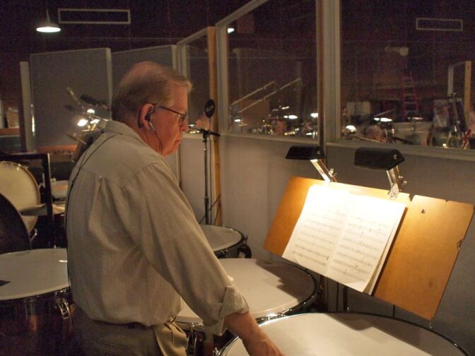 Percussionist Don Williams reading over music during the recording for the score to the film John Carter