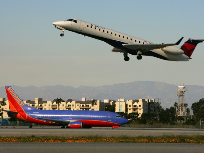 Jets land and take off on runways at Los Angels International Airport (LAX) on February 26, 2008 in Los Angeles, California.