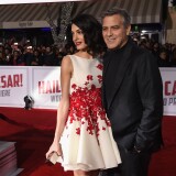 WESTWOOD, CA - FEBRUARY 01:  Actor George Clooney (R) and Amal Clooney attend Universal Pictures' "Hail, Caesar!" premiere at Regency Village Theatre on February 1, 2016 in Westwood, California.  (Photo by Kevin Winter/Getty Images)