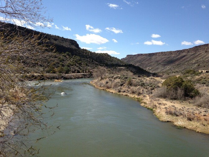 The Rio Grande River south of Taos, New Mexico is flowing with early run off from nearby mountains. Snow is scarce across the Southwest.