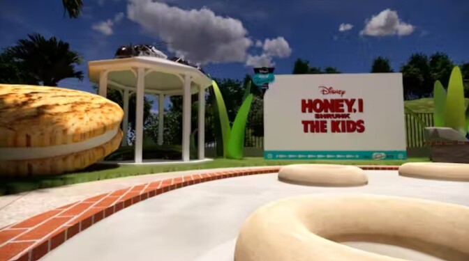 Outdoor pool area with a big screen on a sunny day with clouds in the sky. 