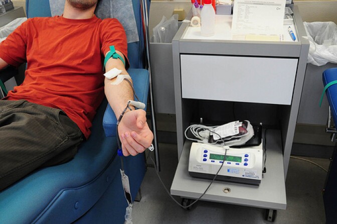 Young man donating blood.