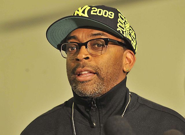 Legendary Filmmaker Spike Lee wearing a New York baseball hat.