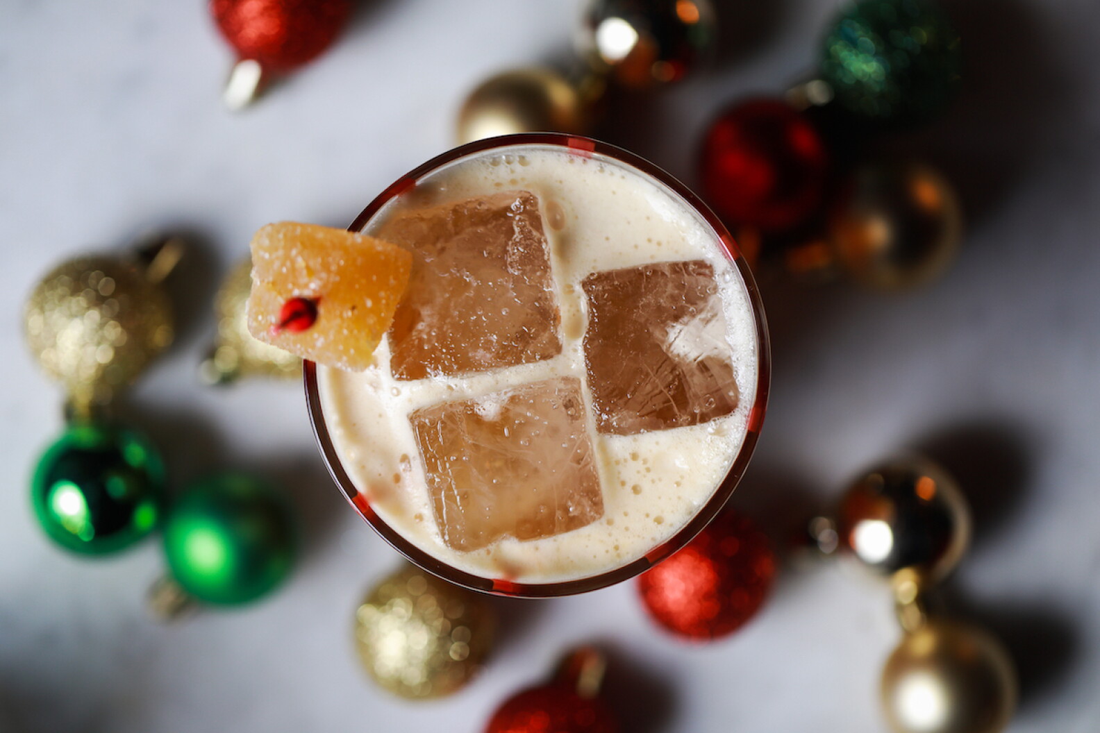 An iced, frothy holiday beverage photographed from overhead.