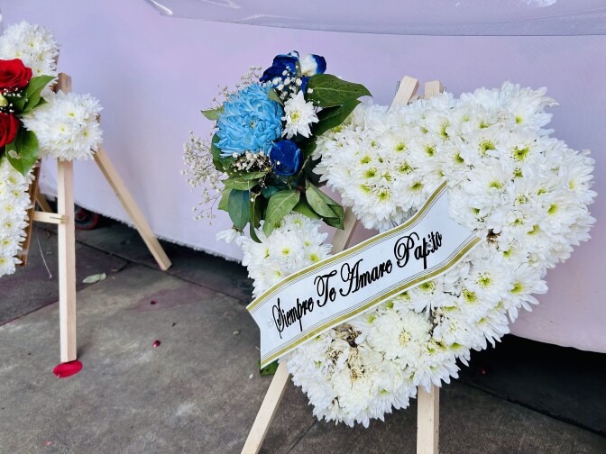 
A flower arrangement in the shape of a heart.