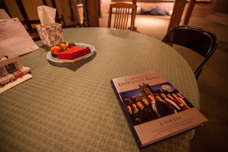 A copy of a book about Downton Abbey rests on a table in the Gamble House basement. Like this limited tour, the British drama features both the owners of the manor and the help.