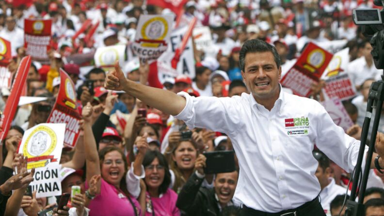 Mexican presidential front-runner Enrique Pena Nieto of the Institutional Revolutionary Party, or PRI, waves to the crowds during a campaign stop in the northern border city of Tijuana, Mexico, on June 3.