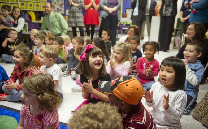 PITTSBURGH, PA-SEPTEMBER 26:  Students clap after Kathy Duritza, a pre-school teacher at the North Hills KinderCare Learning Center,  is surprised with the Early Childhood Educator Award and a USD 10,000 check from Knowledge Universe on September 26, 2012 in Pittsburgh, Pennsylvania.  (Photo by Jeff Swensen/Getty Images for Knowledge Universe)