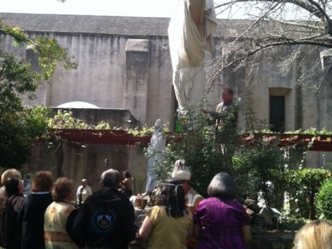 Moments before the volunteer crew unveiled the restored crucifix at the Mission San Gabriel.
