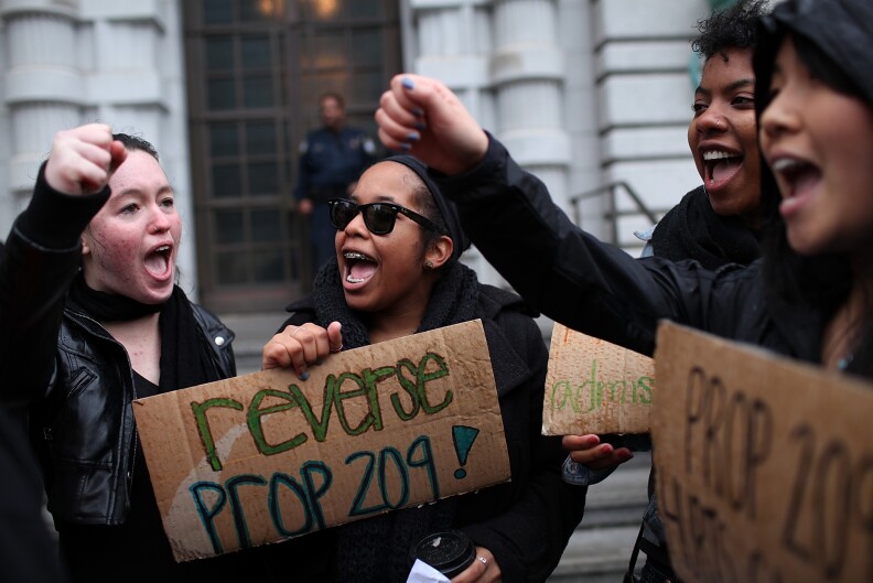 SAN FRANCISCO, CA - FEBRUARY 13:  Students hoping for a repeal of California's Proposition 209 hold signs as they protest outside of the Ninth U.S. Circuit Court of Appeals on February 13, 2012 in San Francisco, California.  A Federal appeals court will hear arguments in a lawsuit that wants to overturn Proposition 209, a voter approved measure that prohibits affirmative action at state universities.  (Photo by Justin Sullivan/Getty Images)