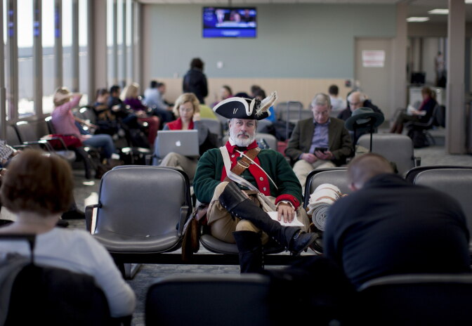 Tea party supporter William Temple, of Brunswick, Ga., sits in the Des Moines Airport heading to go home after the Iowa caucus, Wednesday, Jan. 4, 2012, in Des Moines, Iowa.