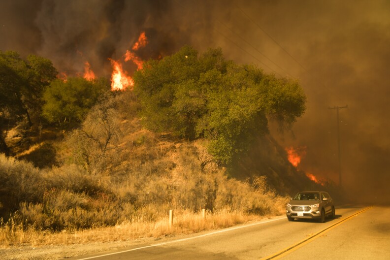The Sand Fire burns intensely off Placerita Canyon Rd Sunday afternoon as a media vehicle races away from flames. 


The Sand Fire burns in the Angeles National Forest Sunday July 24th, 2016 under a Red Flag Warning high high winds. The fire had burned 22,000 acres by Sunday morning and was 10% contained as firefighters battled low humidity, shifting wind, and high temperatures. An unknown number of structures were lost. 
