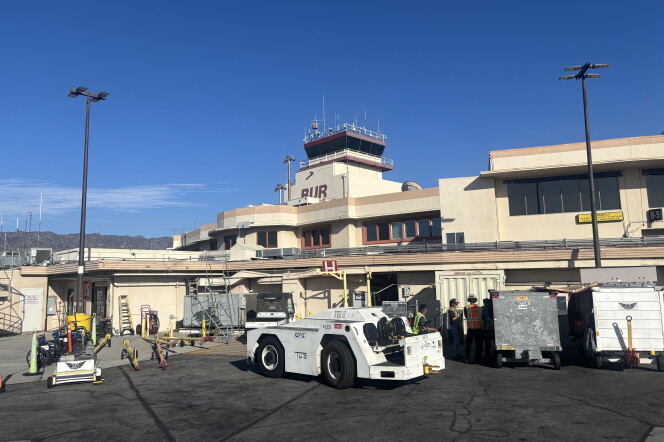 A tower marked BUR is visible in a photo taken from an airport tarmac.