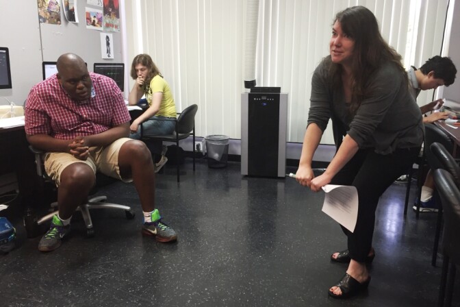 Instructor Kat Cutright gets physical, illustrating the basics concepts of animation with her body, during a summer program at Exceptional Minds.