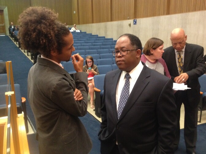 LA County Supervisor Mark Ridley-Thomas, right, speaks with Mark-Anthony Johnson of Dignity and Power Now, a group lobbying for more power for a new Civilian Oversight Commission at the Sheriff's Department.