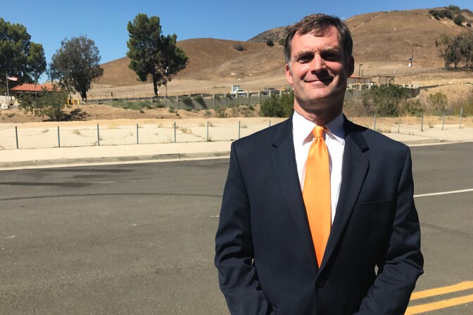 Darrell Park, a candidate for the 5th district LA County Supervisor seat, outside the entrance to the Aliso Canyon storage facility in Porter Ranch.