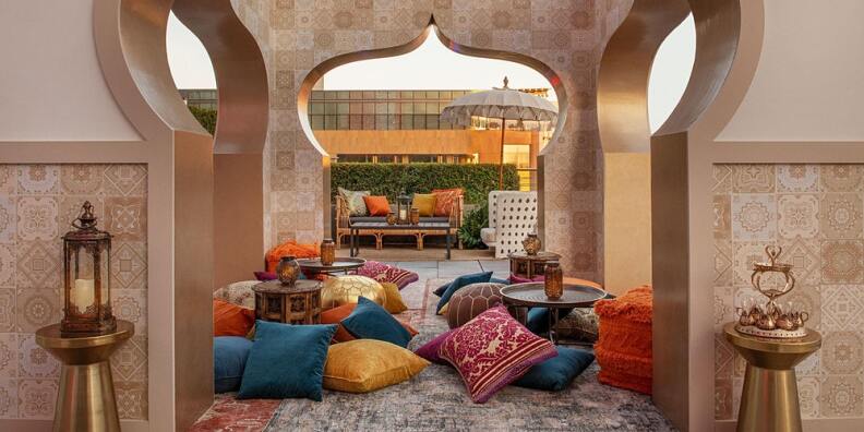 Moroccan style awning filled with colorful pillows.
