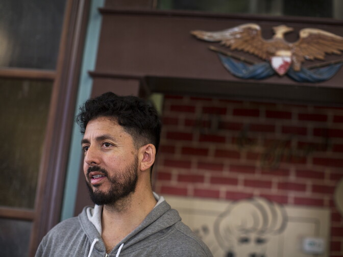 George Mendoza, a Santa Ana native, opened American Barbershop on Fourth Street in 2010. This month, Mendoza is set to open Wursthaus, a German gastropub, across the street.