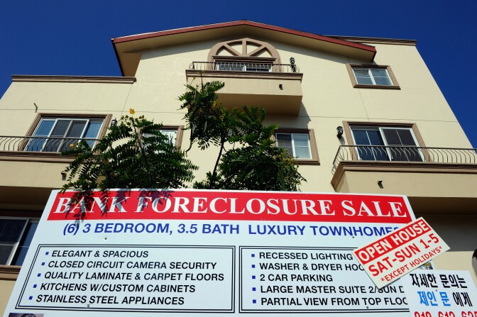 A "bank foreclosure sale" sign is posted in front of townhomes on August 12, 2010 in Los Angeles, California. 